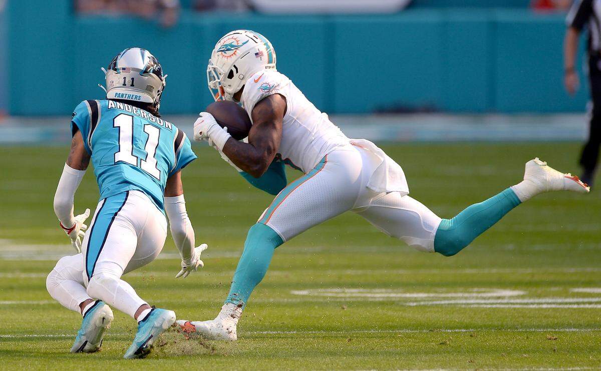 Miami Dolphins safety Jevon Holland intercepts a pass by Carolina Panthers quarterback Cam Newton meant for wide receiver Robby Anderson during second quarter action at Hard Rock Stadium in Miami Gardens, Fla. on Sunday, November 28, 2021.