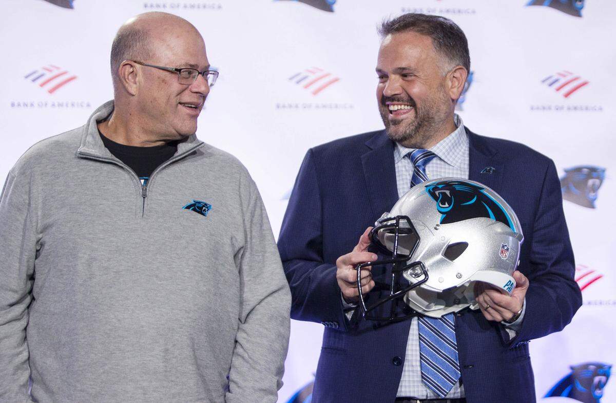 Panthers owner David Tepper and head coach Matt Rhule laugh before taking group photos at the Atrium Health Dome in Charlotte, NC on Wednesday, January 8, 2020.