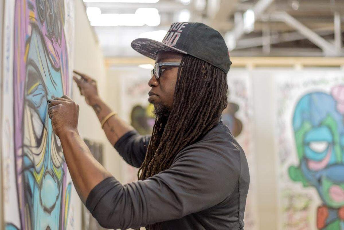 Charlotte artist de’Angelo Dia works on a piece at Goodyear Arts Collective. He is now one of three leaders for the Goodyear Arts Collective, a group of more than 40 GYA artists-in-residence alumni. Dia has also been an artist-in-residence at the Harvey B. Gantt Center for African-American Arts + Culture and the McColl Center for Art + Innovation.