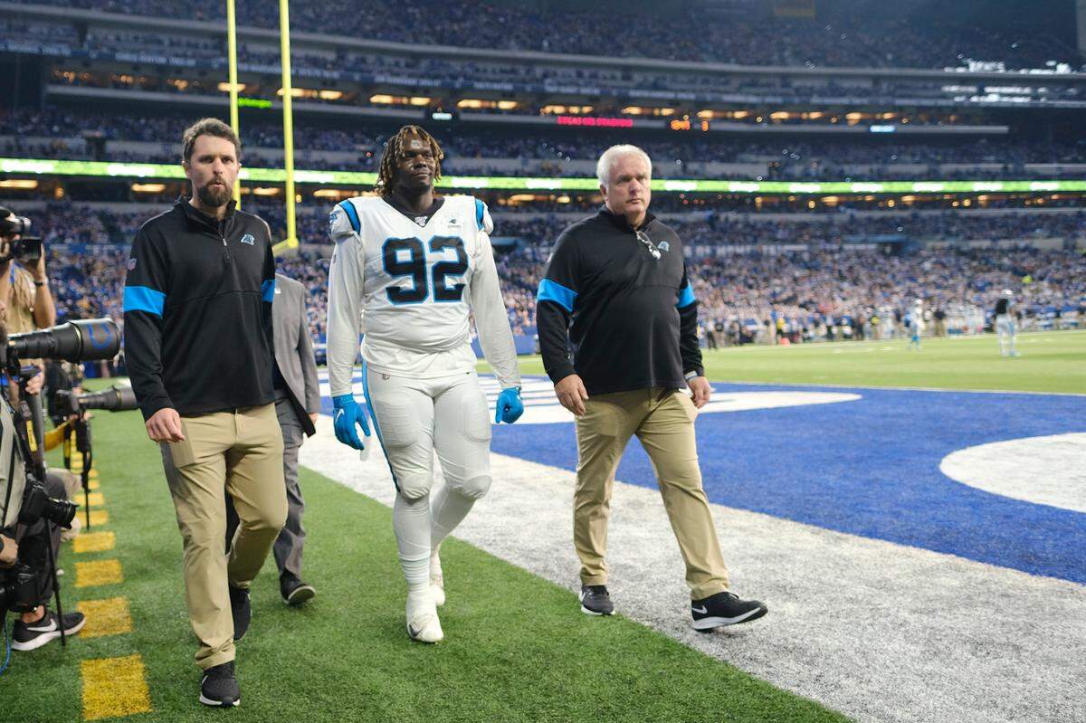 Carolina Panthers defensive tackle Vernon Butler (92) leaves the field after being ejected during the second half Sunday. Butler threw a punch to get ejected, then raised his middle finger to a group of Colts fans as he walked toward the tunnel.
