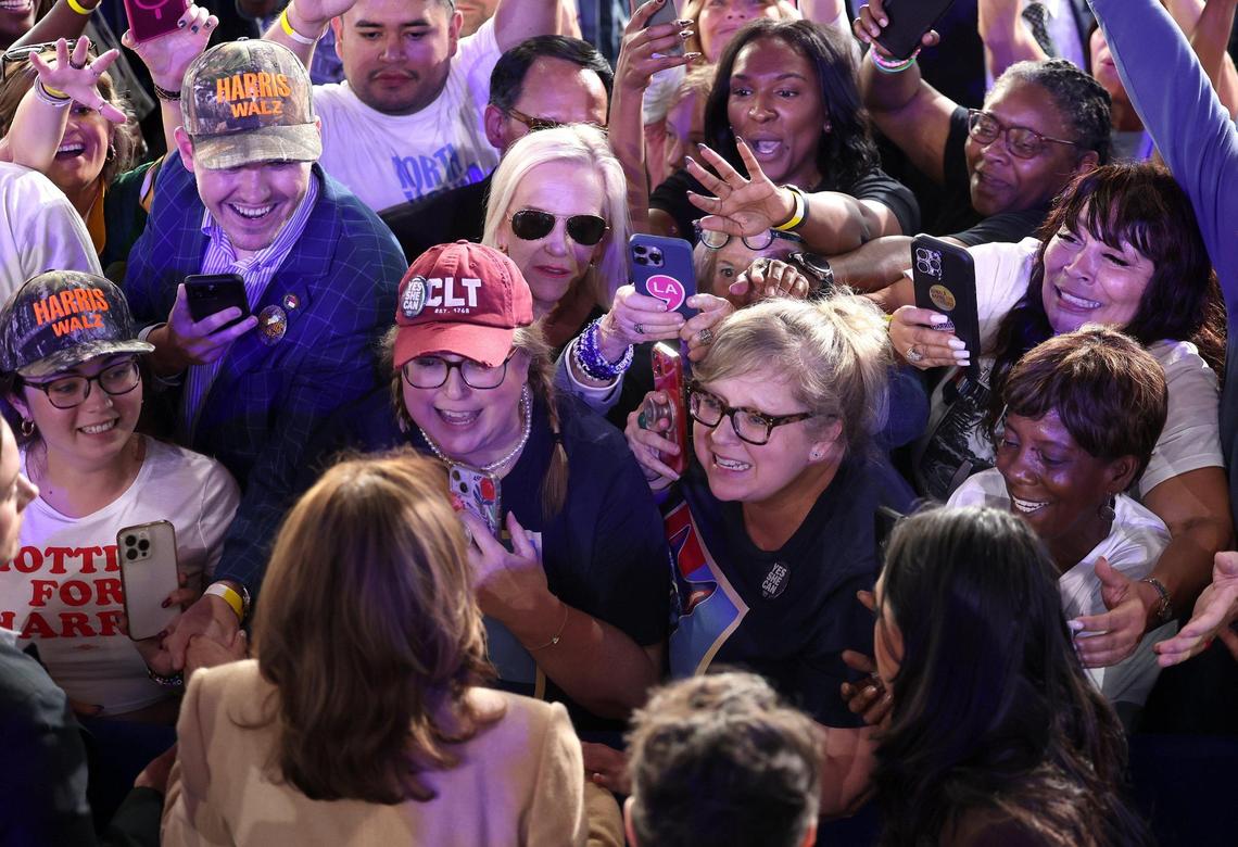 Supporters reach out to Vice President Kamala Harris during a rally at PNC Music Pavilion on Saturday, November 2, 2024.