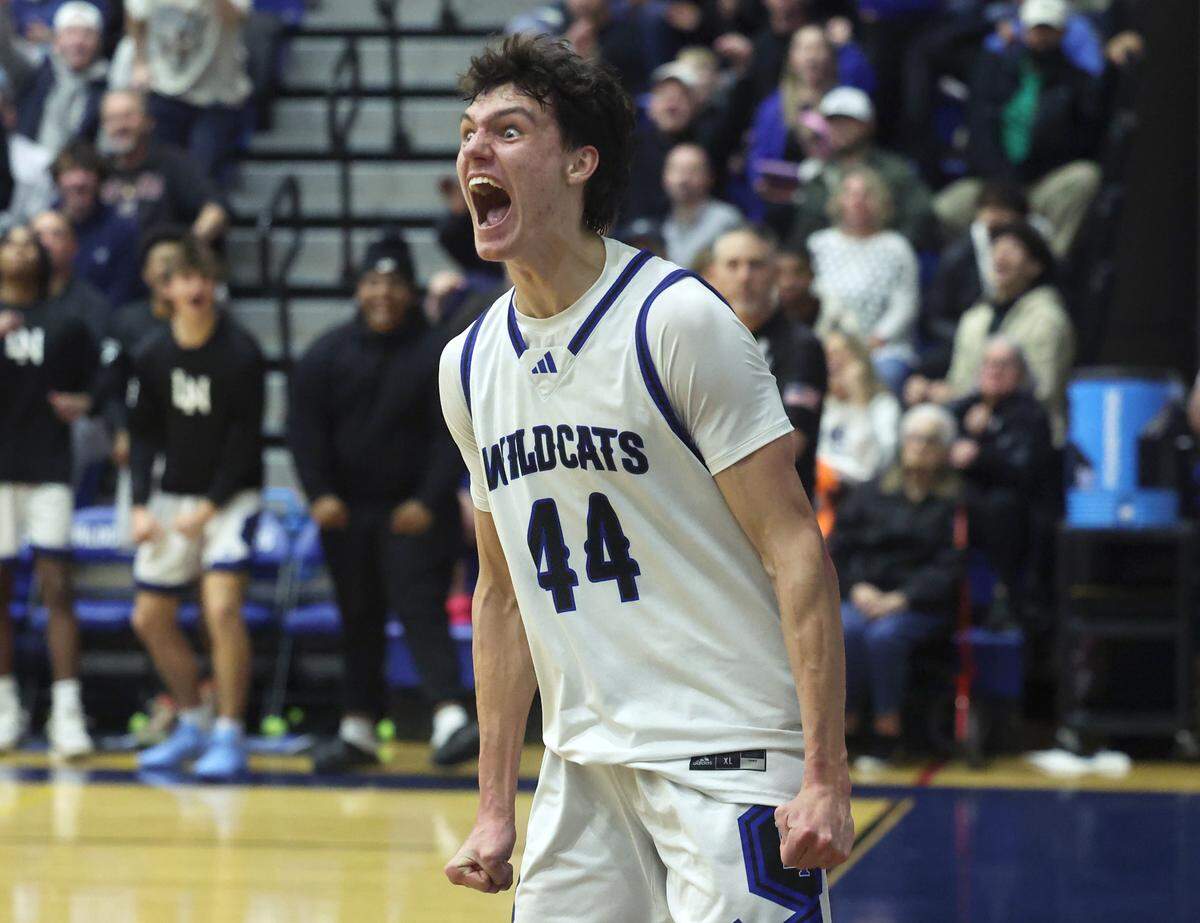 Lake Norman’s Trent Steinour celebrates a play during action against Mooresville on Wednesday, January 22, 2025 at Lake Norman High School. Lake Norman defeated Mooresville 99-71.