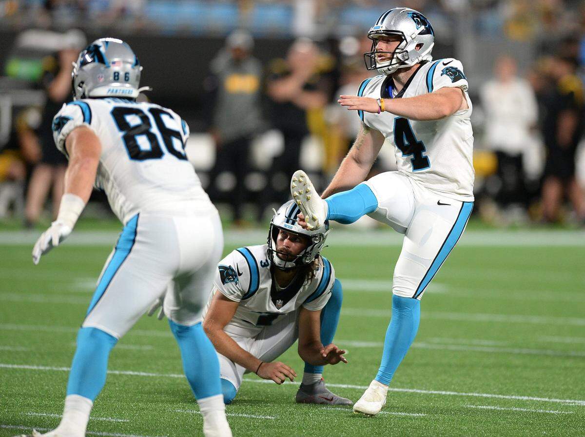 Carolina Panthers kicker Joey Slye, right, follows through on a field goal kick during fourth quarter action against the Pittsburgh Steelers at Bank of America Stadium in Charlotte, NC on Friday, August 27, 2021.