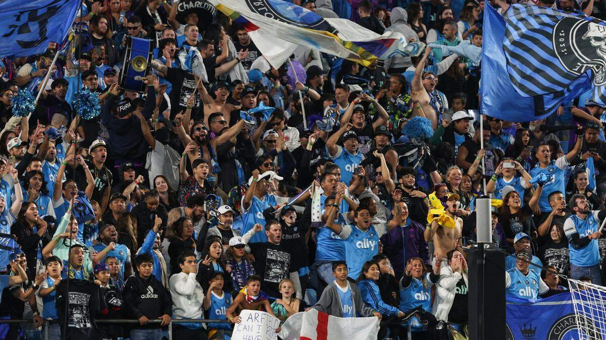 Fans in the stands celebrate Charlotte FC’s 1-0 victory over Inter Miami at Bank of America Stadium on Saturday, October 21, 2023 in Charlotte, NC. With the win, Charlotte FC clinches a spot in the playoffs.