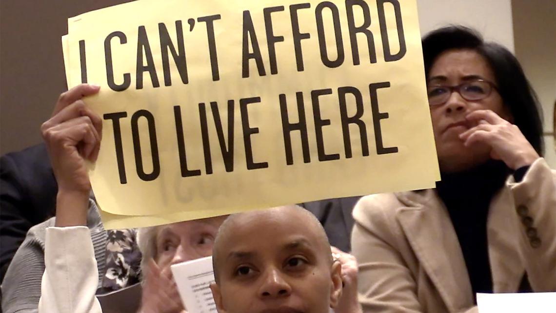At a 2018 Charlotte City Council meeting, residents armed with signs like this tried to make city leaders aware of the affordable housing issue.