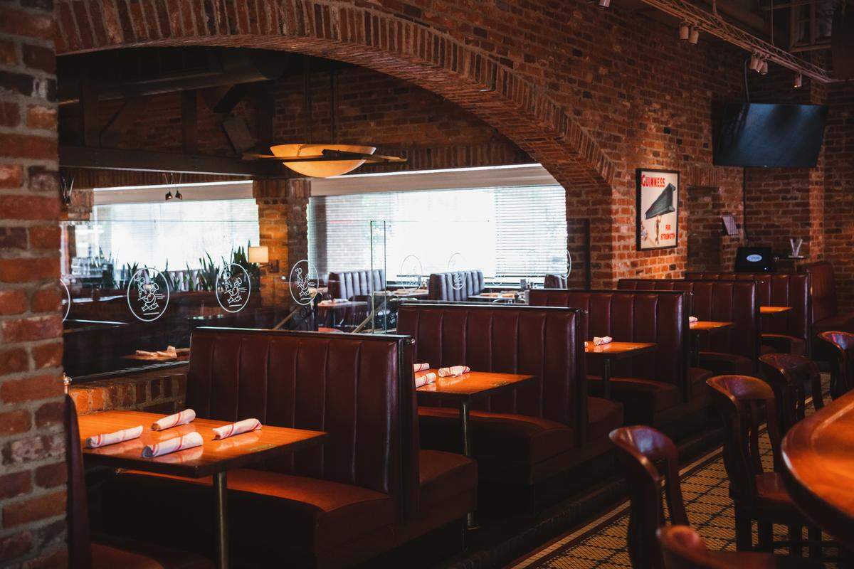 A bank of booths line the wall at Harper’s.