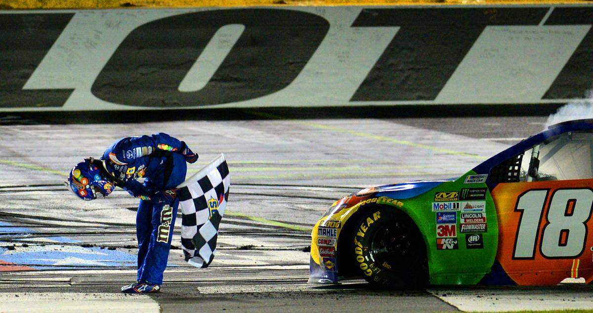 NASCAR driver Kyle Busch bows to the cheers of the fans after winning the NASCAR Monster Energy All-Star Race on Saturday, May 20, 2017 at Charlotte Motor Speedway in Concord, NC. 