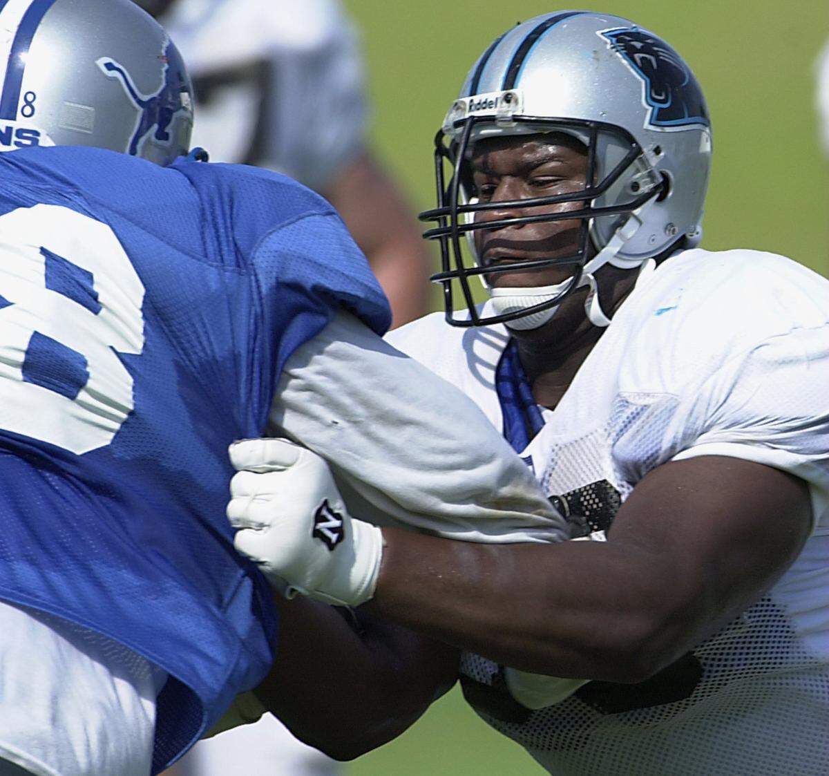 7/26/00 (R) Carolina Panther center (63) Jamar Nesbit tries to slow down a Detroit Lion defender Wednesday during the team’s morning practice session in Spartanburg, SC. JEFF SINER/STAFF