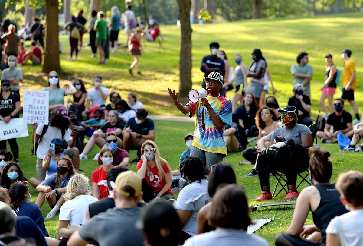 Glo Merriweather, center, teaches a breakout session to people during a People’s University training session at Freedom Park in Charlotte, NC, on Thursday, June 4, 2020.