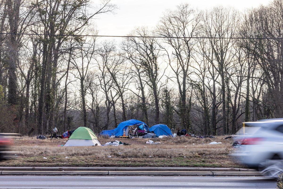 A lot is occupied by people living in tents on Sugar Creek road in Charlotte, N.C., on Friday, February 10, 2023.