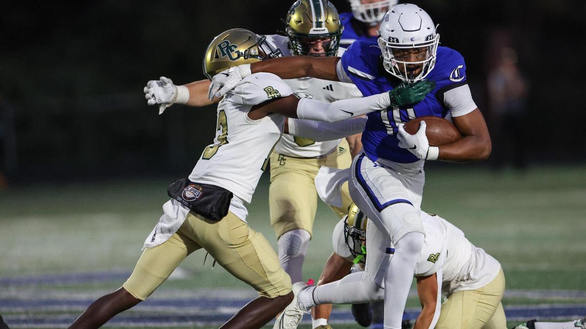 Charlotte Christian’s Micah Gilbert, right, tries to outrun Rabun Gap’s defense during the game on Friday, September 29, 2023 in Charlotte, NC.