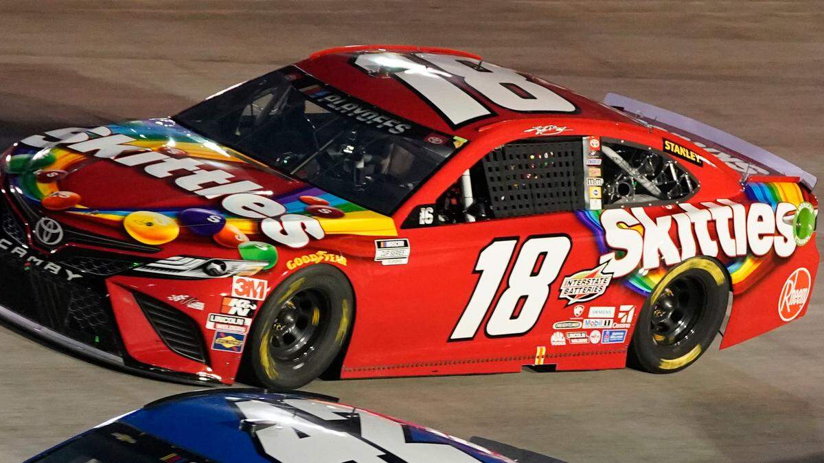 Matt Kenseth (42) and Kyle Busch (18) drive into Turn 1 during the NASCAR Cup Series auto race Saturday, Sept. 19, 2020, in Bristol, Tenn. (AP Photo/Steve Helber)