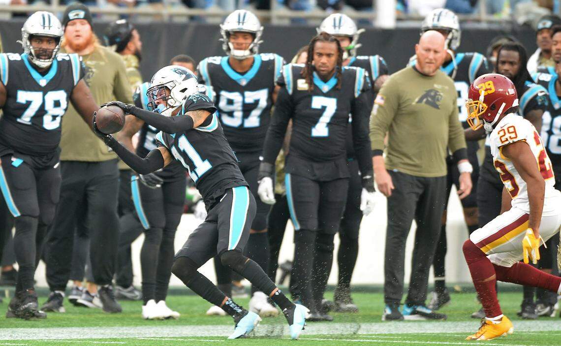 Carolina Panthers wide receiver Robby Anderson catches a pass from quarterback Cam Newton during fourth quarter action against the Washington football team during fourth quarter action at Bank of America Stadium in Charlotte, NC on Sunday, November 21, 2021.