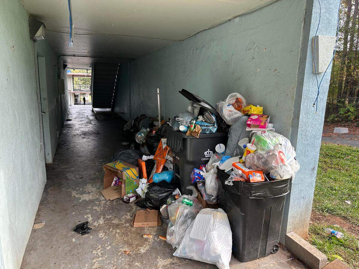 Tenants said trash has stopped being collected at the hotel and is piling up in walkways, attracting pests and making it difficult to walk around at times. One tenant said she’s paid strangers to take the trash away.