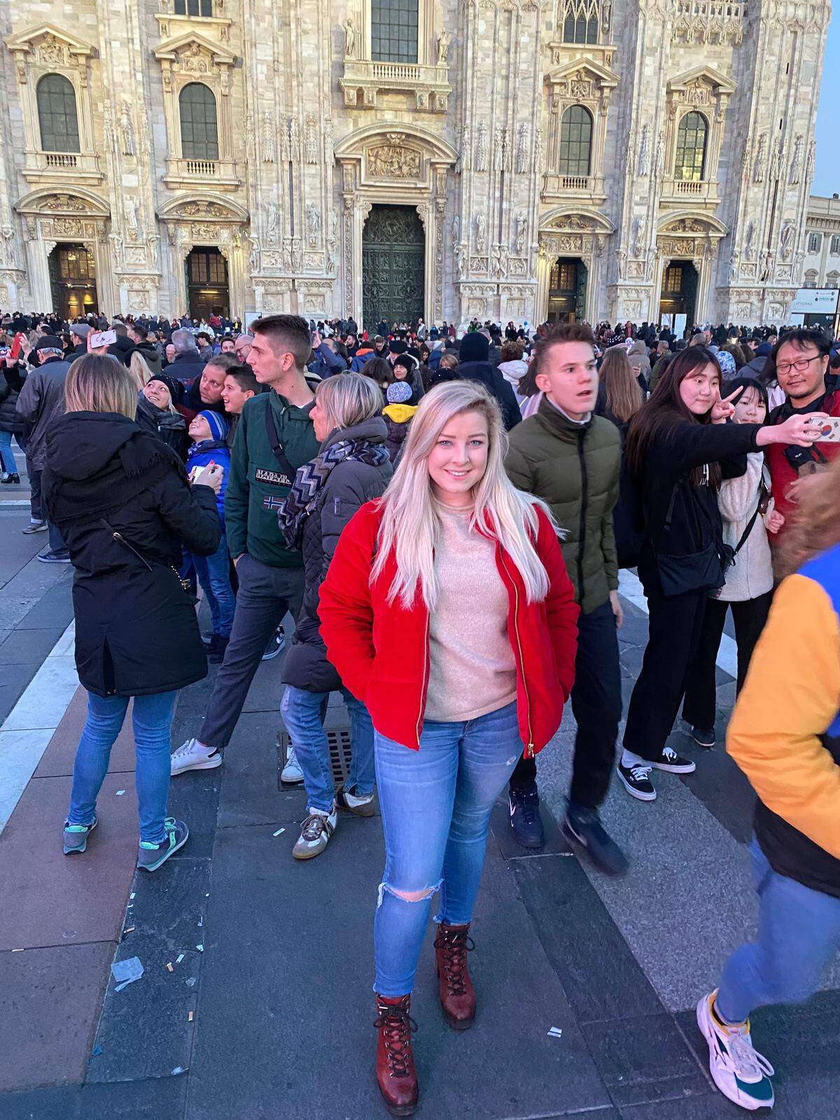 Charlotte-area grad student Rebecca Ross poses in front of the Duomo cathedral in Milan -- a popular tourist attraction in the center of the city -- before the coronavirus outbreak in Italy.