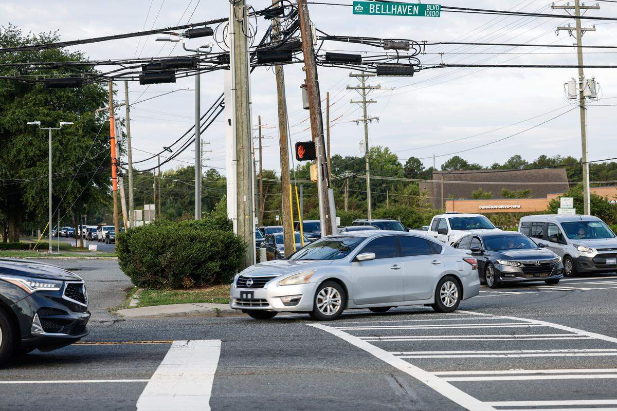 A long line of cars turn at the intersection of Mt. Holly-Huntersville Road and Bellhaven Boulevard in Charlotte. Mt. Holly-Huntersville Road is an approximately 15-mile, state owned, two-lane corridor. 