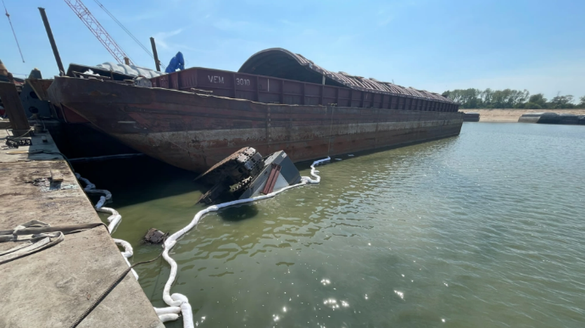 A good Samaritan is credited with saving a man left pinned upside down underwater, when a crane flipped into Tennessee’s murky McKellar Lake and sank.