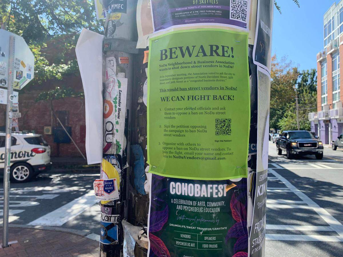 A flyer on a post in NoDa urges people to sign a petition in support of street vendors who sell art, clothing and more along N. Davidson Street.