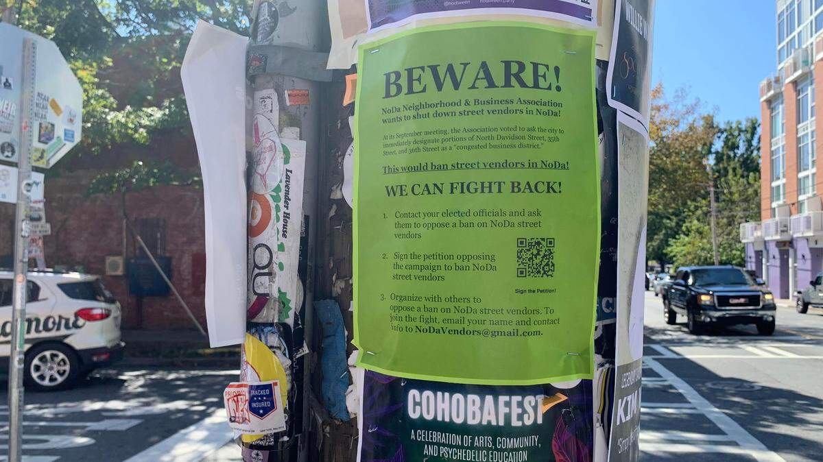 A flyer on a post in NoDa urges people to sign a petition in support of street vendors who sell art, clothing and more along N. Davidson Street.