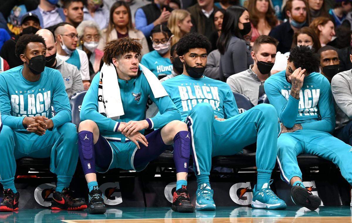 (Left-Right) Charlotte Hornets guards Ish Smith, LaMelo Ball, center Nick Richards and guard James Bouknight sit on the teamÕs bench as the Miami Heat extend their lead during second half action at Spectrum Center on Saturday, February 5, 2022 in Charlotte, NC. The Heat defeated the Hornets 104-86.
