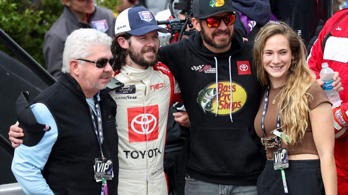 NASCAR Xfinity Series driver Ryan Truex (second from left) celebrates in victory lane with his girlfriend Leah Schwandt (right) and brother NASCAR Cup Series driver Martin Truex Jr (second from right) and his father Martin Truex Sr (left) after winning Saturday’s A-GAME 200 at Dover Motor Speedway. Matthew OHaren-USA TODAY Sports