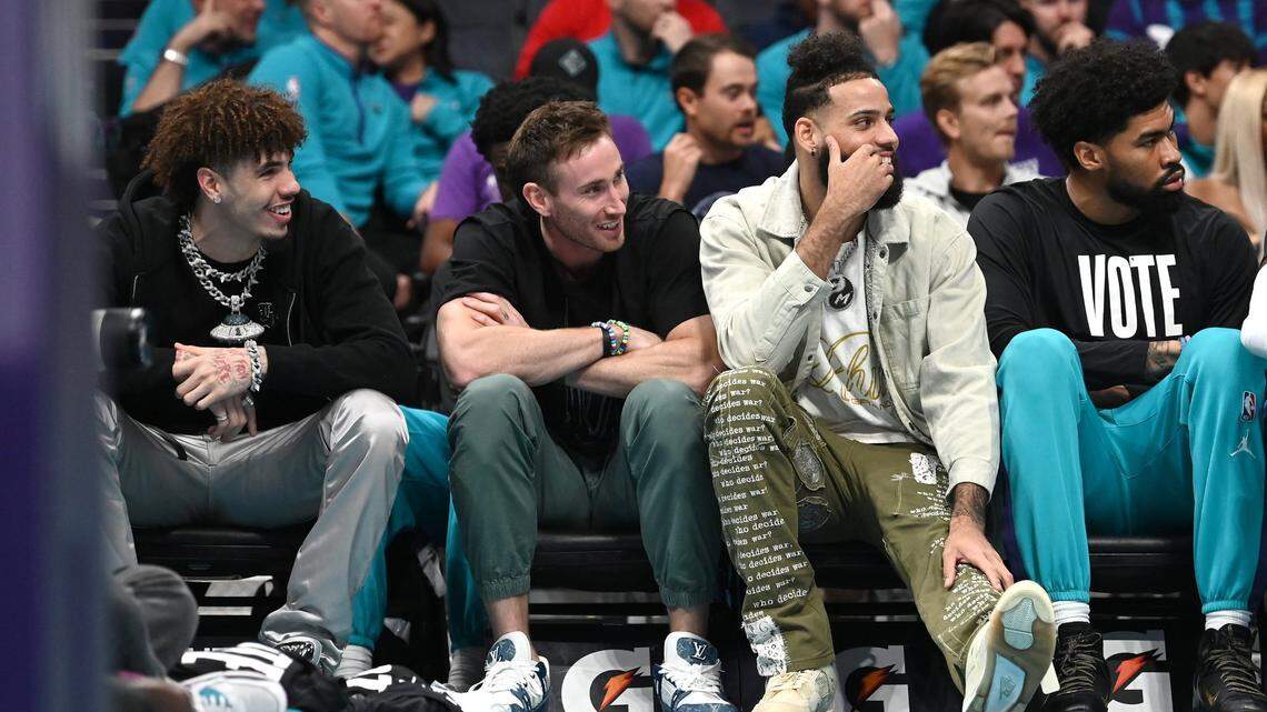(L-R) Injured Charlotte Hornets guard LaMelo Ball, forward Gordon Hayward and forward Cody Martin sit on the team’s bench during the team’s game against the Washington Wizards at Spectrum Center in Charlotte, NC on Monday, November 7, 2022. The Wizards defeated the Hornets 108-100.