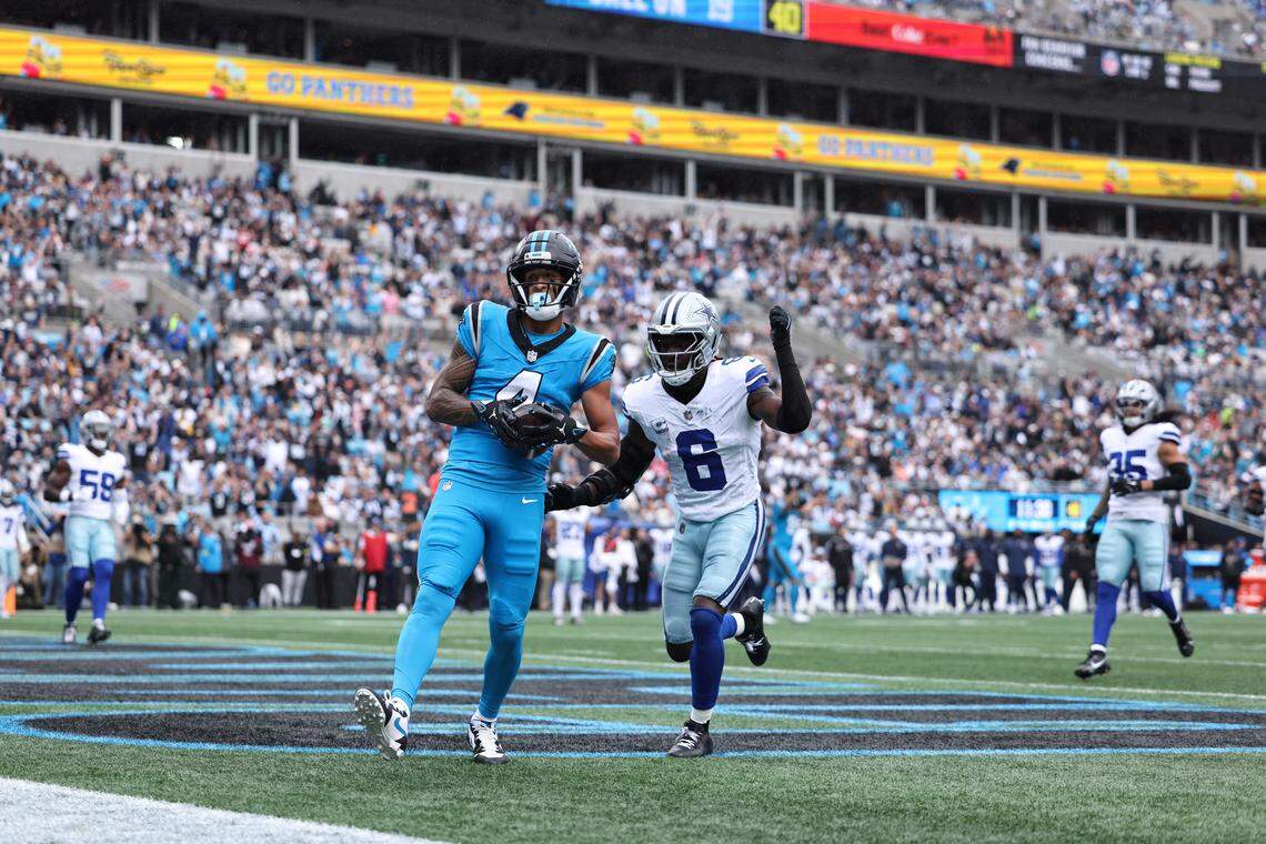 Tetairoa McMillan catches a pass from Bryce Young during the Panthers-Cowboys game on Oct. 12, 2025, in Charlotte. 