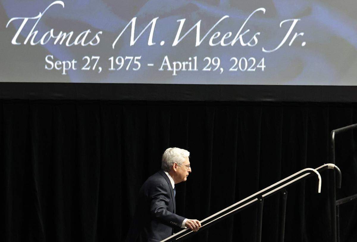 Attorney General Merrick B. Garland climbs the stairs to the lectern to speak during a memorial service for slain U.S. Marshal Thomas Weeks Jr., at Bojangles Coliseum in Charlotte, NC on Monday, May 6, 2024. U.S. Marshal Thomas Weeks Jr., died during a standoff with a gunman on Monday, April 29th 2024. Two other law enforcement officers were also killed in the shootout. CMPD Officer Joshua Eyer passed away later Monday evening from injuries sustained during the shootout.