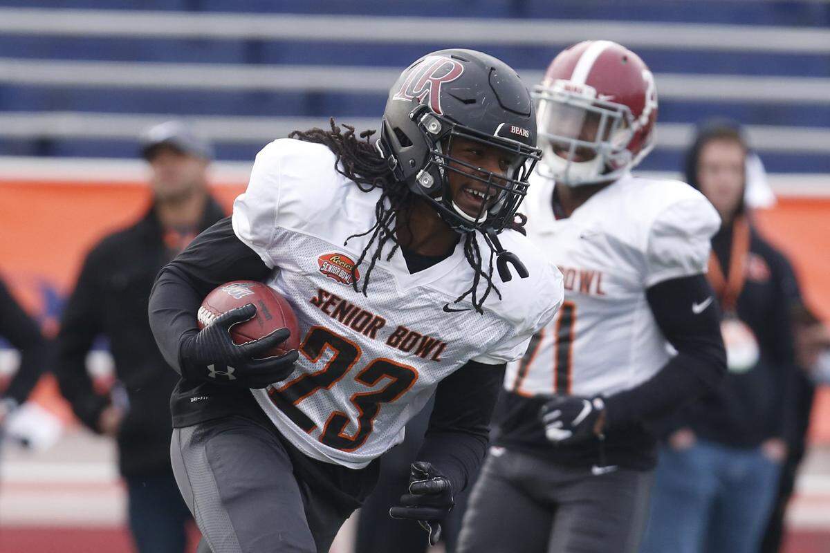 Lenoir Rhyne’s Kyle Dugger carries the ball as the South squad runs drills during practice for the Senior Bowl Wednesday, Jan. 22, 2020, in Mobile, Ala. (AP Photo/Butch Dill)