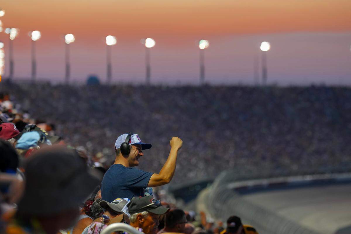 A fan reacts to action on the track during the NASCAR Cook Out Southern 500 at Darlington Raceway.