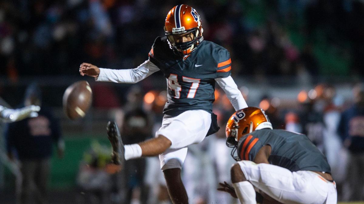 Chambers’ kicker, Melvin Benitez, kicks the ball for an extra point after a touchdown during the game against Weddington in the state quarterfinals on Friday, November 26, 2021 in Weddington, NC.