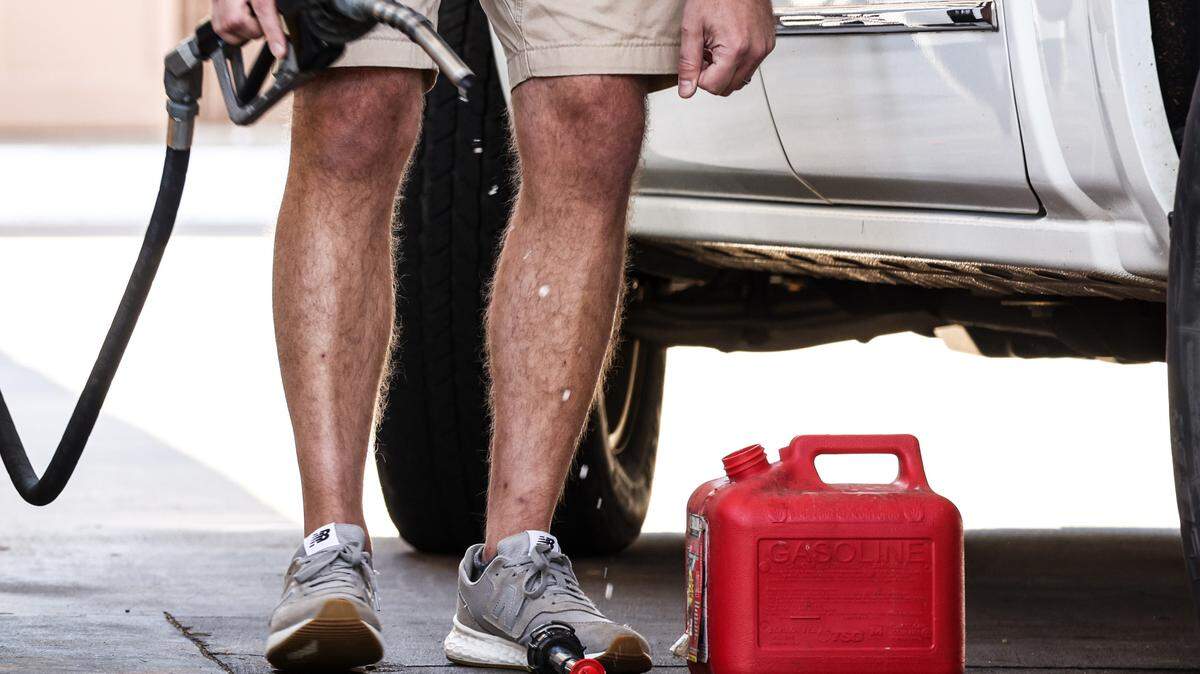 A man fills up a gas can at the Circle K on Randolph Road in Charlotte, N.C., on Thursday, May 13, 2021.