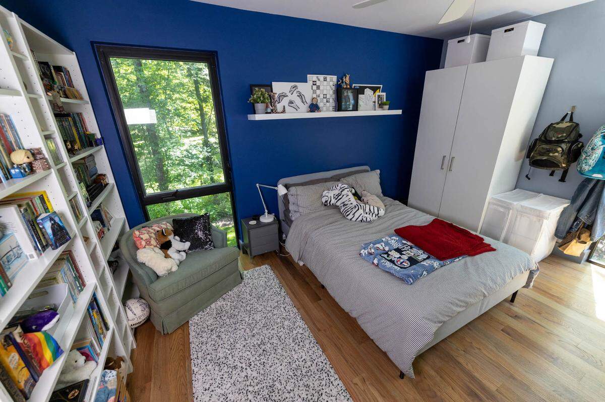 One upstairs bedroom has a view of the woods, again bringing the green space inside.