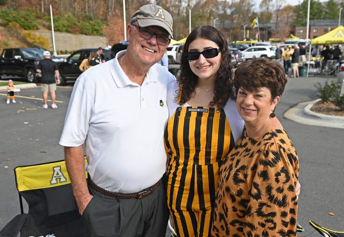 Appalachian State alums Danny Caddell, left and wife, Carolina Caddell, right, were joined by their granddaughter and App State student Hannah Caddell, center, for tailgating fun outside Kidd Brewer Stadium in Boone, NC on Saturday, October 26, 2024. Appalachian State played Georgia State in the first home game since Hurricane Helene struck the area.