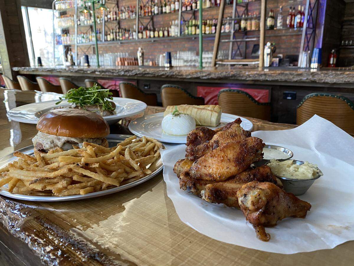 Charlotte Beer Garden will serve items such as a Mushroom Burger, left, and Dry rubbed wings served with bleu cheese or ranch dressing, right.