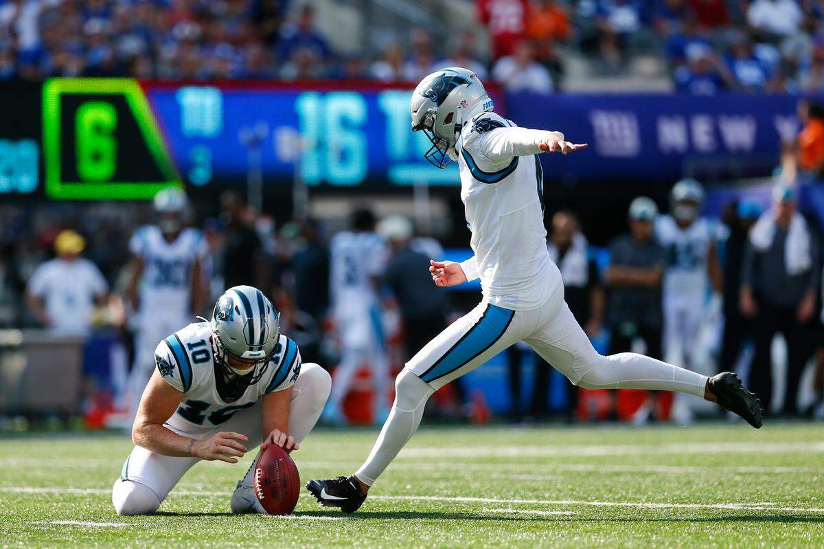 Carolina Panthers kicker Eddy Pineiro, right, kicks a field goal during the second half an NFL football game against the New York Giants, Sunday, Sept. 18, 2022, in East Rutherford, N.J. (AP Photo/John Munson)