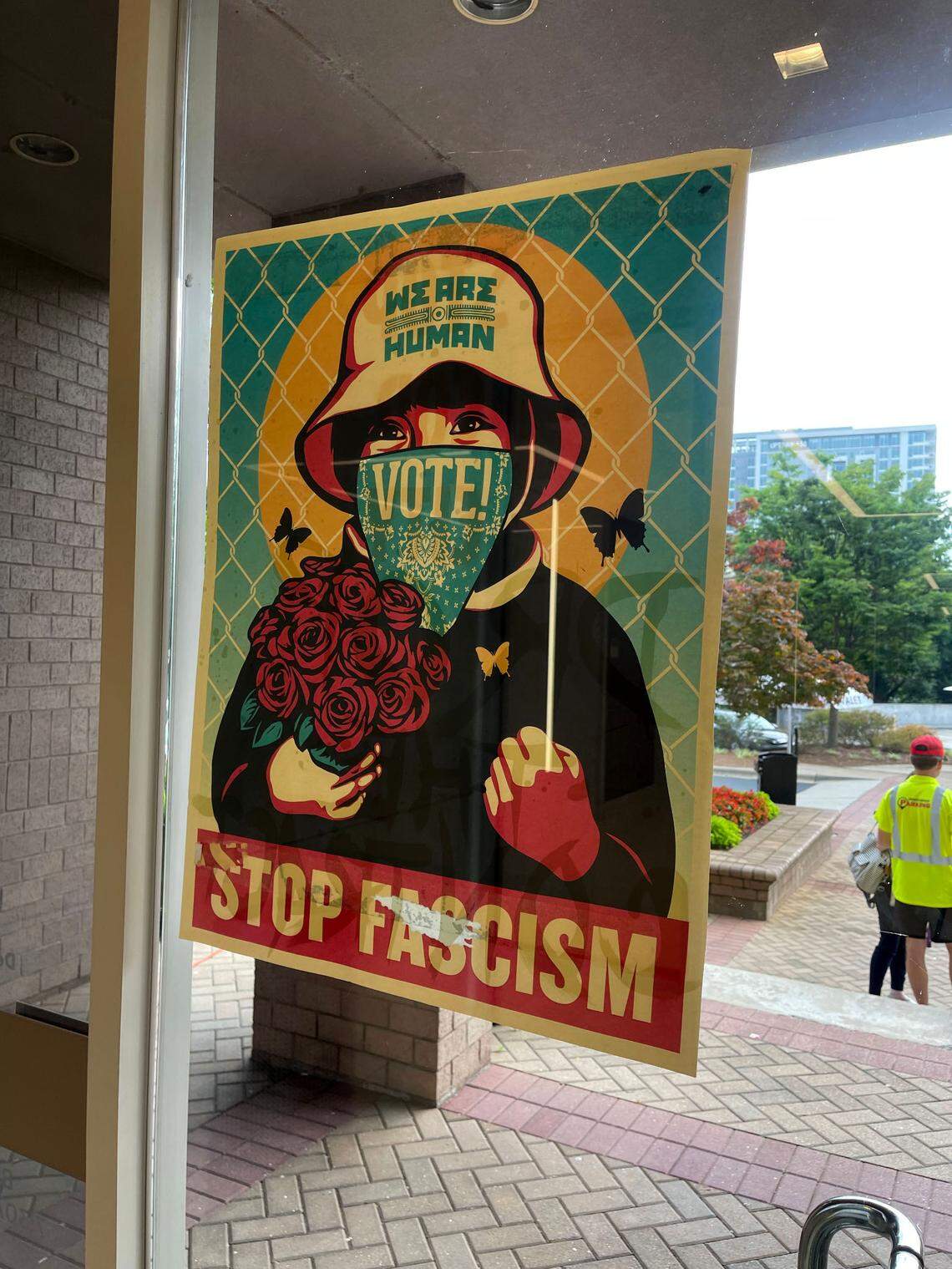 Protesters from Defend the Atlanta Forest taped a “Stop Facism” poster next to a door of a Charlotte office building on Friday.