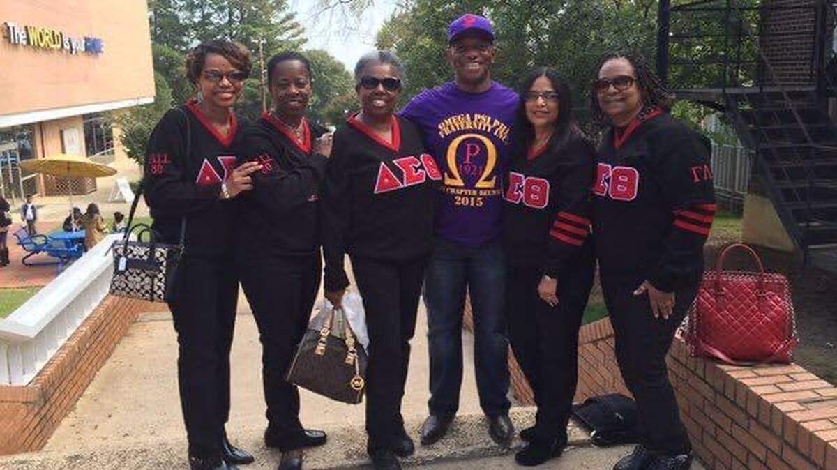Mecklenburg County Sheriff Garry McFadden, an Omega Psi Phi member, with members from the Delta Sigma Theta Sorority. McFadden will be at the 83rd Grand Conclave held from July 22-26 at the Charlotte Convention Center.
