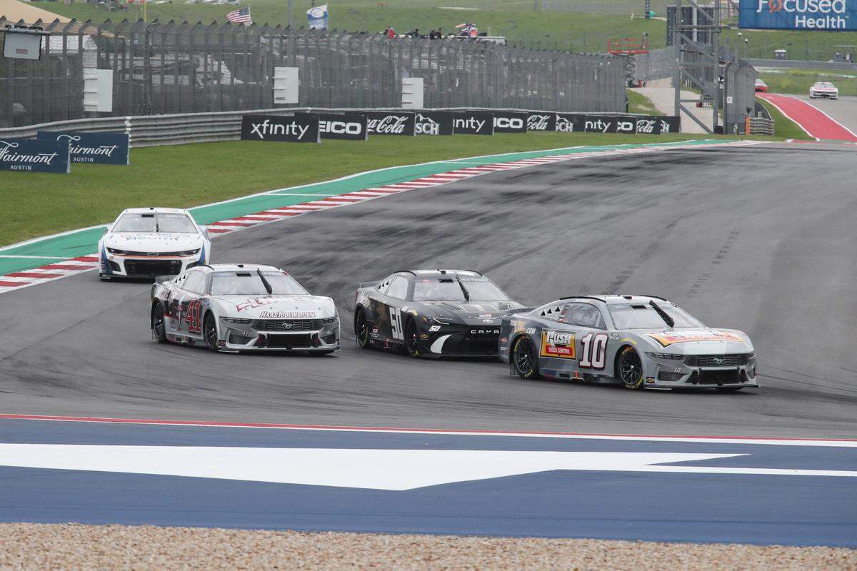 Mar 24, 2024; Austin, Texas, USA; NASCAR Cup Series driver Noah Gragson (1), driver Kamui Kobayashi (50), driver Ryan Preece (41) in turn 12 during the EchoPark Automotive Grand Prix at Circuit of the Americas.