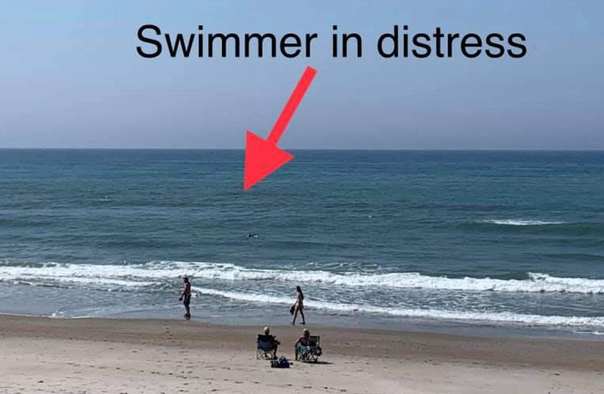 The swimmer rescued Tuesday off Pine Knoll Shores was so far out, he could hardly be seen, say town officials.