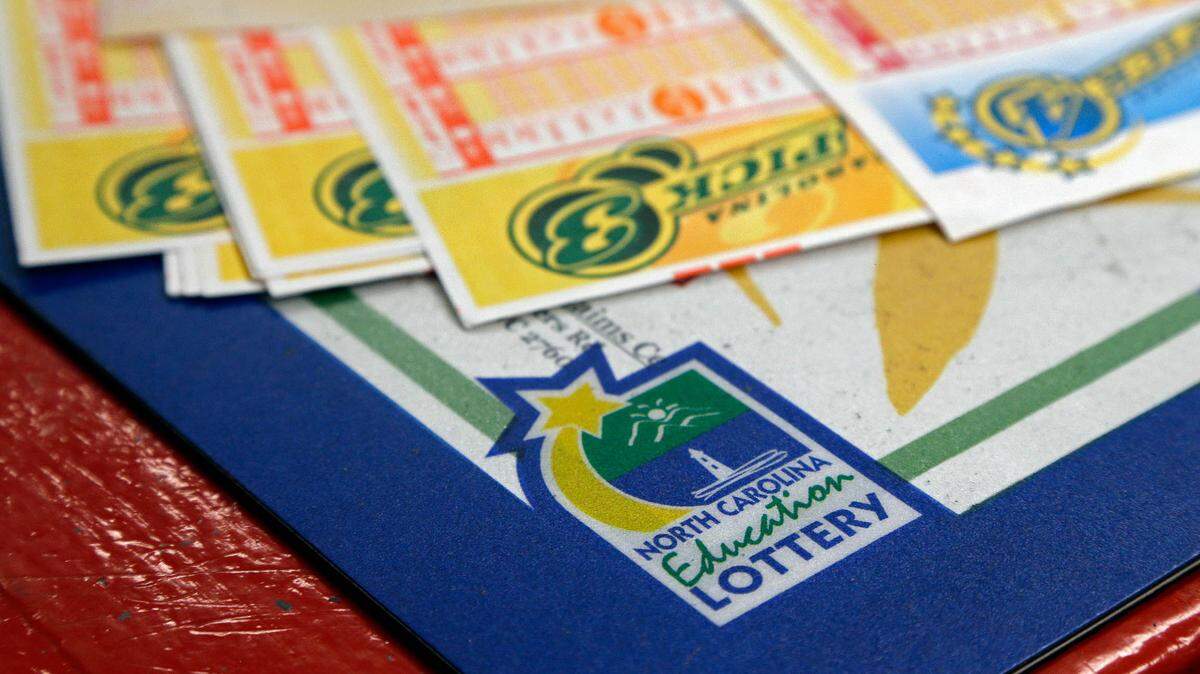 The man said he woke up one morning with the strong feeling he should buy a lottery ticket that day. (AP Photo/Gerry Broome)