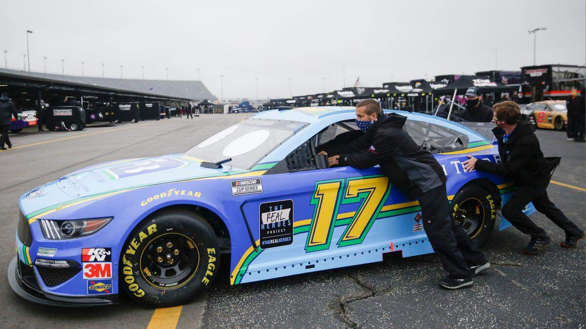 The car for driver Chris Buescher is pushed to the garage before the Toyota 500 NASCAR Cup Series auto race Wednesday, May 20, 2020, in Darlington, S.C. (AP Photo/Brynn Anderson)