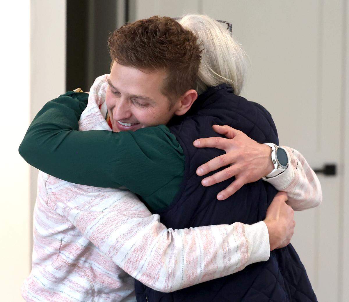 Val Kovalenko shares a hug with Jennifer Carter, the nurse who helped save his life on Dec. 13.