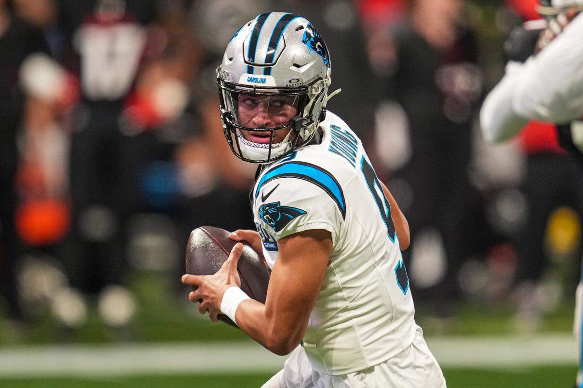Jan 5, 2025; Atlanta, Georgia, USA; Carolina Panthers quarterback Bryce Young (9) rolls out to pass against the Atlanta Falcons during the first quarter at Mercedes-Benz Stadium. Mandatory Credit: Dale Zanine-Imagn Images