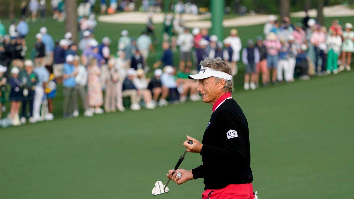 Bernhard Langer walks off the no. 2 green during the first round of the Masters Tournament. 