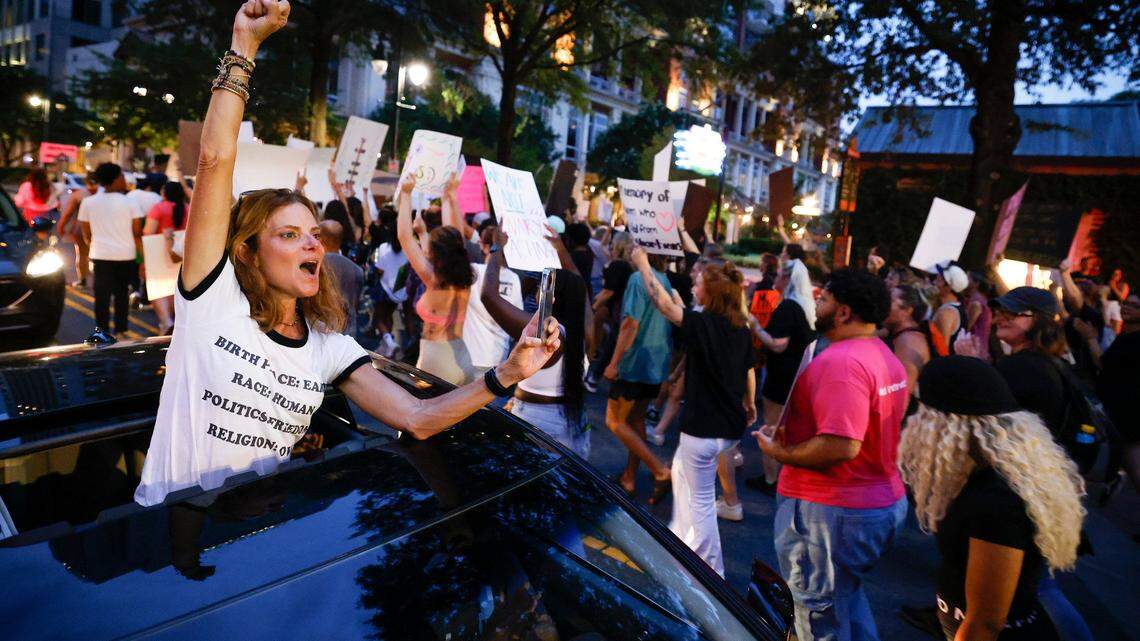 Lisa Landrum, of Charlotte, shows solidarity with abortion rights activists as they march through uptown Charlotte, June 26, 2022. The demonstration was in response to last week’s decision from the U.S. Supreme Court to overturn Roe v. Wade.