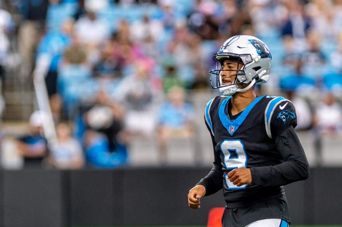 Carolina Panthers quarterback Bryce Young jogs on the field during the Carolina Panthers' fan fest open practice at the Bank of America Stadium in Charlotte, NC, Saturday August 2, 2025.