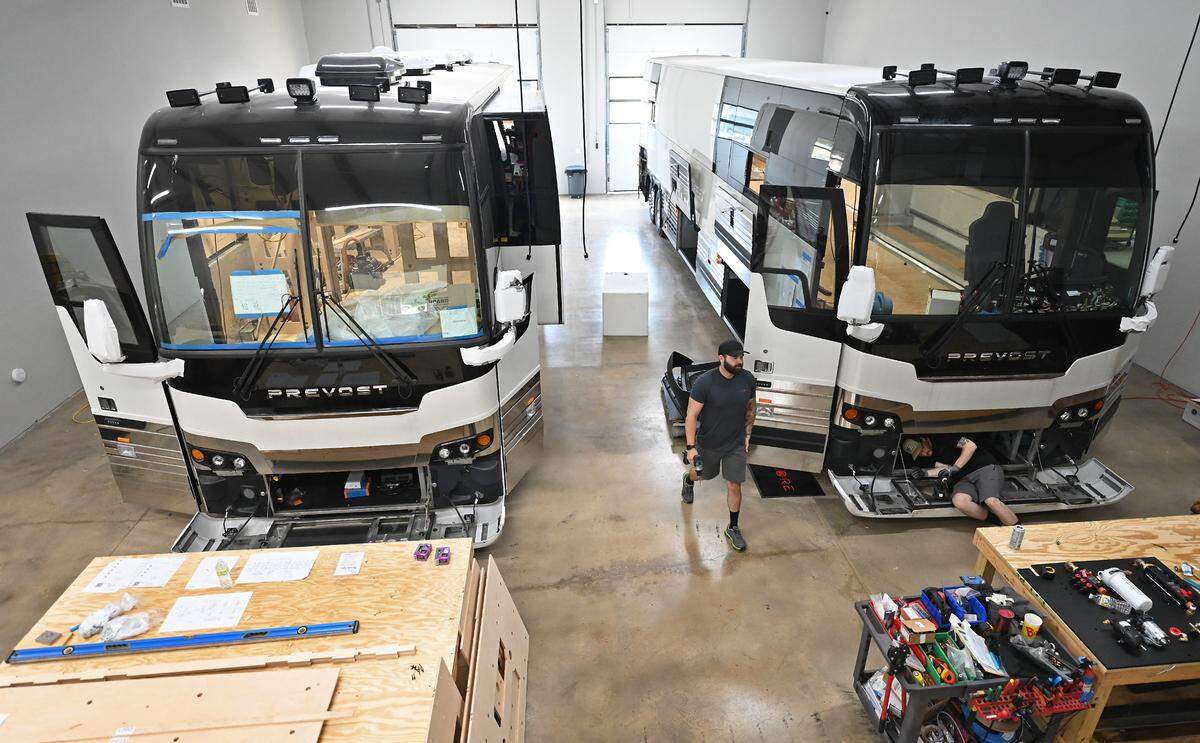 Work continues on two of the Encore Luxury Coaches at the company’s Cornelius factory.