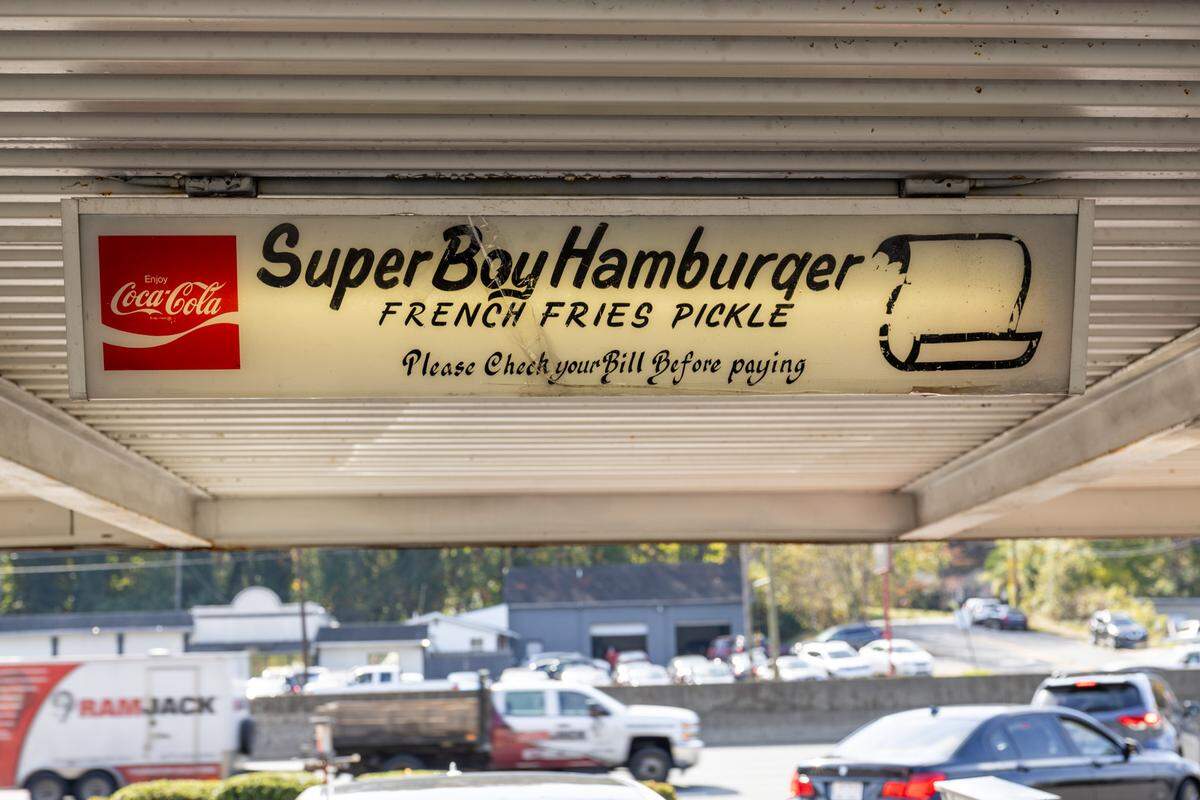 A sign under the drive-up roof at South 21.