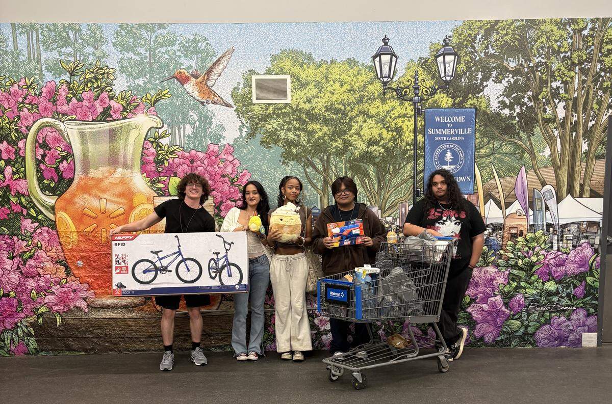 Caden Sellers, far left, and friends who helped him purchase gifts for three area children, with money they raised for the Salvation Army of Greater Charlotte’s Angel Tree program. From left, Sellers, Marina Moncada, Carmen “Kaleb” Tate, Mark Halagao and Logan Johnson. Sellers, Halagao and Johnson worked together to raise money for the program.
